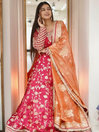 Make a ravishing statement in this vibrant pink Anarkali suit, where femininity meets fearless flair.