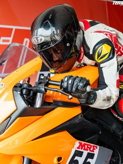 A close up of a rider's intense focus. From this perspective, you can see the concentration required to pilot a race machine at speed, a skill honed through countless hours of practice.