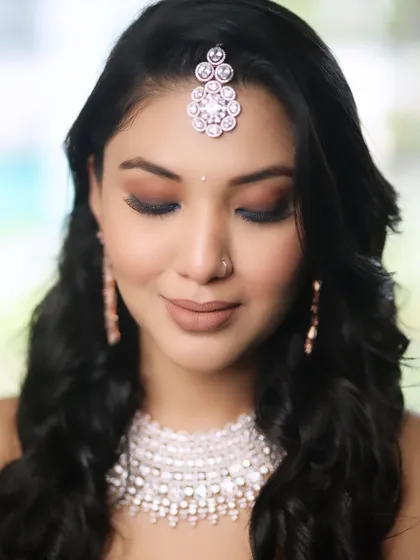 A beautiful close-up from a creative shoot, showcasing a soft brown smokey eye and a perfectly defined nude lip. This is a timeless and versatile look.