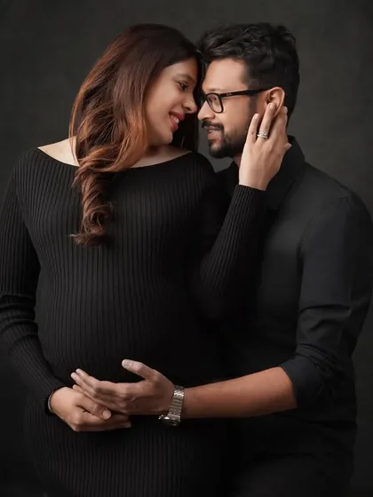 This color version of an intimate couple's portrait showcases the warmth and connection between them. The soft lighting highlights their expressions and the gentle embrace.
