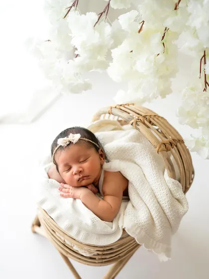 Another angle of the rattan bassinet setup, showing the beautiful textures and the peacefulness of the moment.
