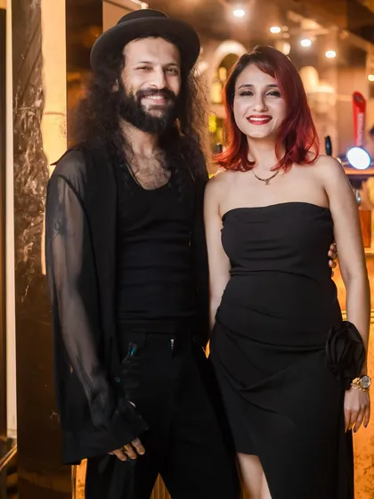 A well-dressed couple ready for a night of dancing.