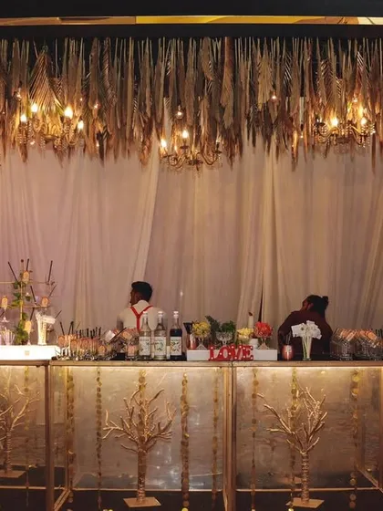 A bar should be more than just a counter; it should be a masterpiece. I design and execute stunning, luxurious bar setups like this one, complete with elegant decor and professional service to match the grandeur of your wedding.