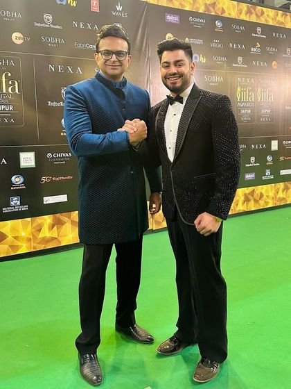 On the green carpet at the IIFA Awards. My embellished black tuxedo stands next to a stylish blue bandhgala, showcasing two different approaches to modern formal wear.