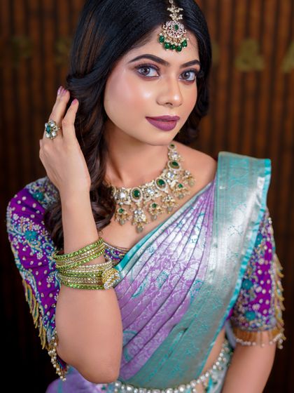 A series of photos showcasing a beautiful pastel purple and green silk saree. The soft, modern drape is perfect for a reception or pre-wedding event photoshoot.