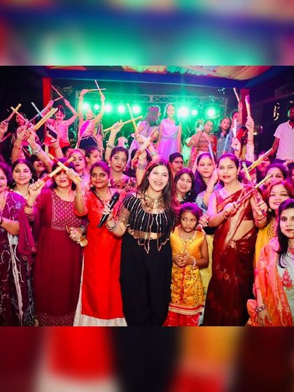 A fantastic group photo with all the energetic ladies at a Navratri Dandiya night. The collective energy was incredible.