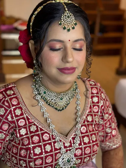 A close-up of the bride's makeup, showing the shimmering eye shadow and perfectly blended base.
