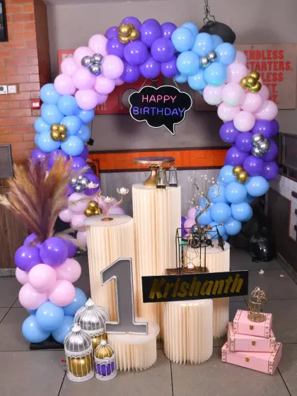 A Minnie Mouse first birthday party setup without the cake, showing the versatility of the backdrop for photos.