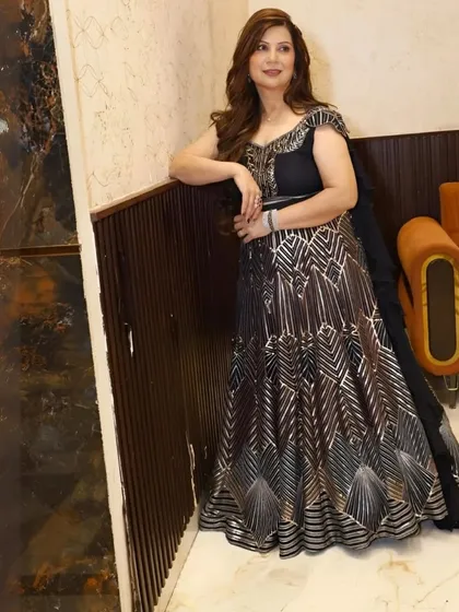 A stylish pose showing off the full silhouette of the black and silver gown. The way the fabric falls is just beautiful.