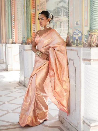 A full-length view of our beautiful baby pink Banarasi silk saree, a timeless and elegant choice for any wedding or festive occasion.