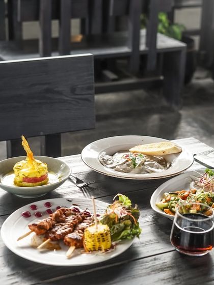 A full spread of our delicious food laid out on a table, ready for a feast. There's something for everyone to enjoy.