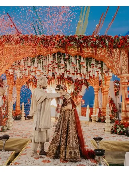 A vibrant Varmala moment, complete with a shower of confetti. We capture the energy and excitement of this key Hindu wedding ritual.