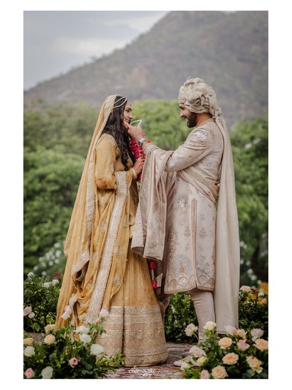 The groom placing the garland on his bride, a moment of gentle love.
