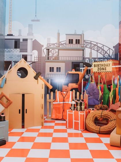 A construction-themed photo booth for Sidhant's 'Road Attack' birthday party. The backdrop and props create a fun, immersive setting for pictures.