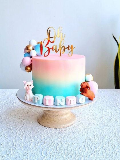 A full view of the ombre baby shower cake.