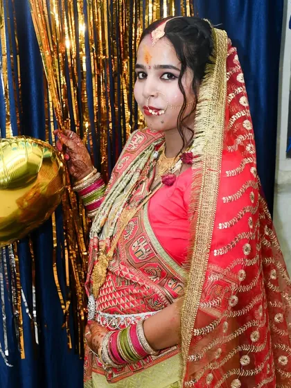 A portrait of a mother-to-be in beautiful traditional attire during her indoor baby shower ceremony. We cover cultural family events with care.