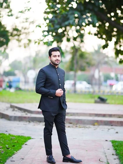 An outdoor shot of the same client, showing how the grooming looks just as good in natural light. The clean, classic look is versatile and timeless.