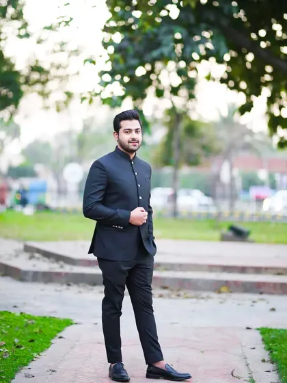 An outdoor shot of the groom in his Jodhpuri suit. This versatile outfit works well in both indoor and outdoor settings.
