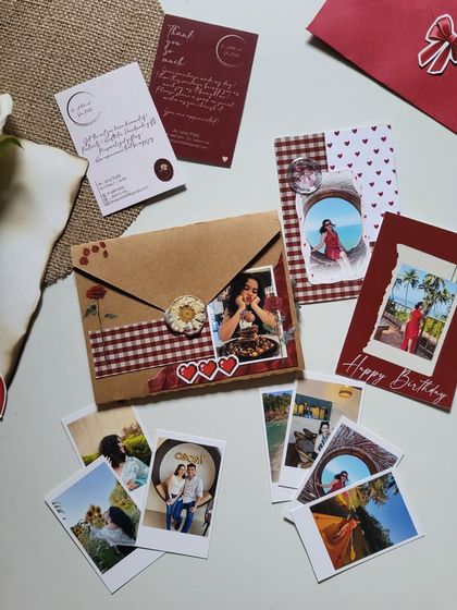 Little hampers like this can make your special one's day. This set includes a mini flap book, polaroids, and other small, personalized items.