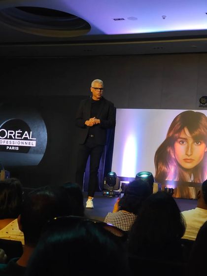 Watching a master stylist from L'Oreal demonstrate advanced techniques on stage. These sessions provide a lot of inspiration and new ideas for my clients.