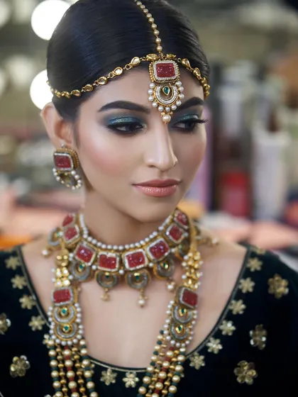 A striking portrait of the bride. Her eyes are mesmerizing, with the deep teal shadow making them pop.
