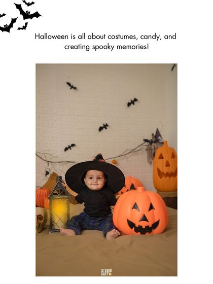 A baby in a witch hat sits next to a smiling jack-o'-lantern.
