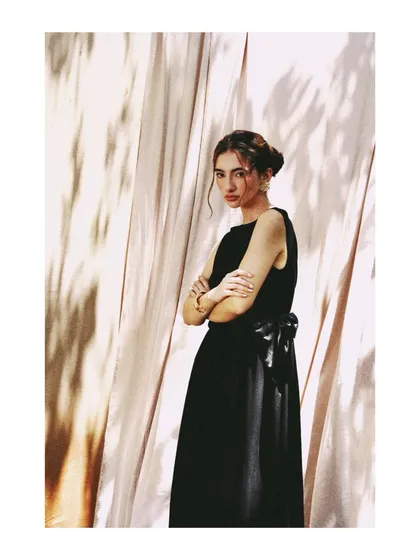 Another shot of the black dress for AVEKA, this time with a more direct and confident pose. The shadows from the foliage create a beautiful, dappled pattern on the backdrop.