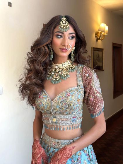 A stunning bridal look with voluminous, open waves. This style is perfect for a bride who wants a glamorous, high impact hairstyle.