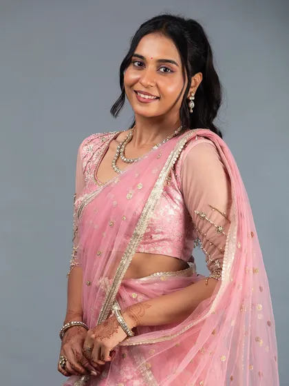 This client truly felt like a princess in her custom pink lehenga, and her joy is what makes my work so rewarding.