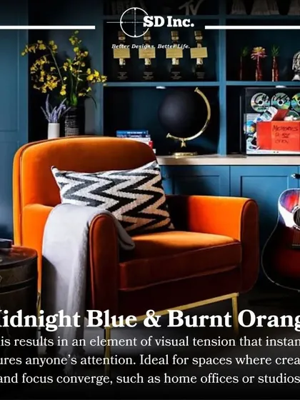 A creative home office or studio space featuring a bold burnt orange armchair against a midnight blue bookshelf. This color combination creates visual tension and stimulates creativity.