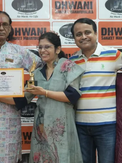 A family celebrates together as one of our adult students receives her award.