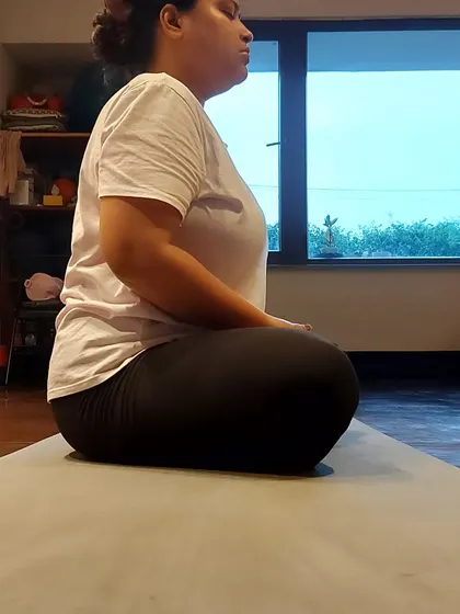 A student practices Yoni Mudra, a technique that helps improve metabolism and brings a sense of inner connection.
