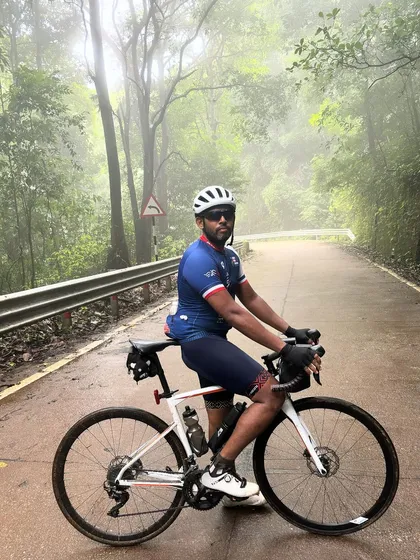 A rider poses in the misty forests of the Western Ghats during the Jog Falls 1000K BRM. The unpredictable weather is part of what makes this ride so challenging and memorable.
