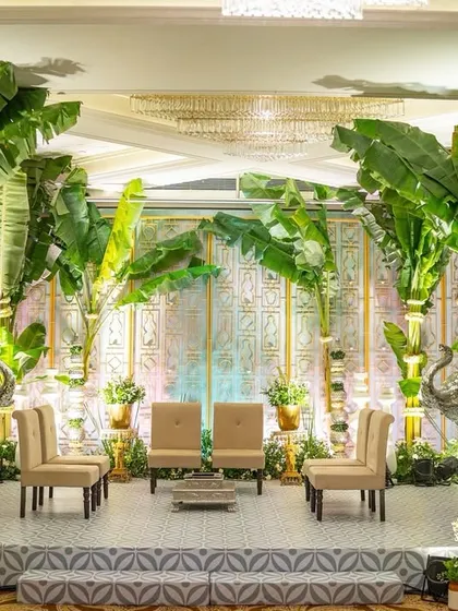 The 'Kel Baradari' mandap, where we used towering banana trees to create a natural and sacred canopy. The design for Nicola and Varun's wedding was rooted in tradition, focusing on organic elements and symbolic greenery.