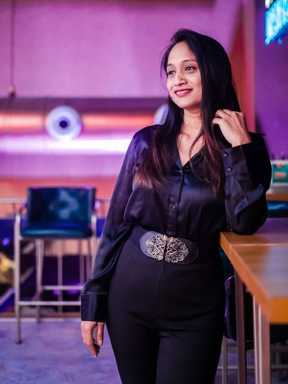 Another stylish guest posing against the unique backdrop of the club.