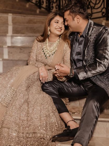 An intimate glance between the couple. The soft lighting highlights the beautiful dimension and glow of the bride's makeup.