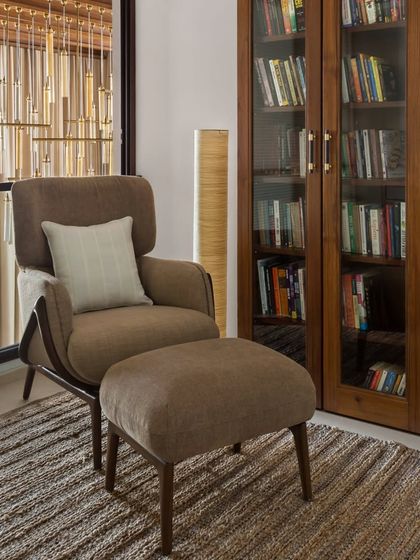 The private study in the House of Terraces is a quiet sanctuary for reading. It features a large bookshelf and a comfortable armchair, creating the perfect literary escape.