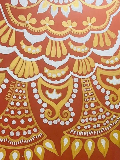 This is the 'Ethnic Ether Mural' I painted in Hyderabad. The deep red wall was the perfect canvas for these radiant gold and ivory patterns, creating a rich, festive, and traditional feel.