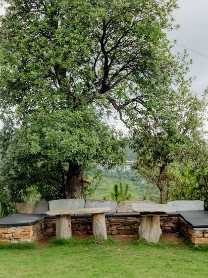 Our outdoor seating area, crafted from local stone and wood, is a popular spot for group discussions, morning tea, or simply soaking in the peaceful atmosphere.