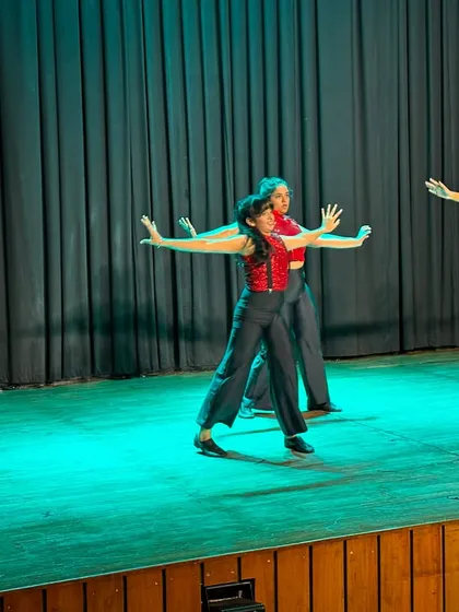 A snapshot of our Adult Jazz performers executing a classic jazz pose with precision during the recital. Their performance highlights the technique and artistry honed in our adult classes.