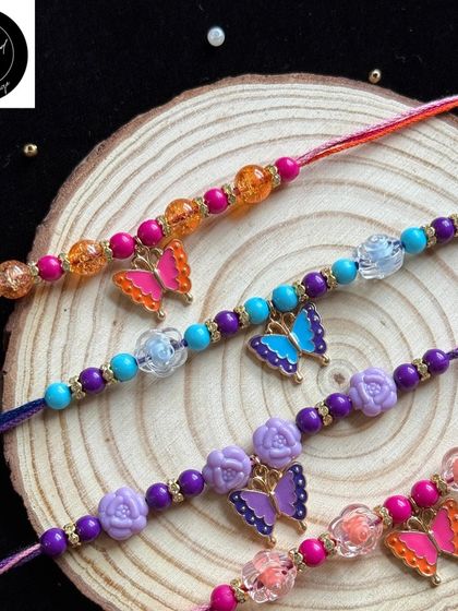 Delicate butterfly rakhis for a sweet and gentle bond. These come in various colors with beautiful beads, perfect for a little sister or brother.