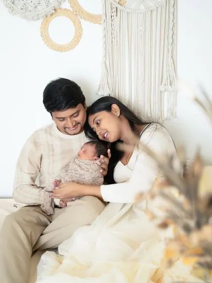 A relaxed lifestyle family portrait in my cozy studio corner. The bohemian-inspired macrame decor adds a touch of warmth to this sweet family moment.