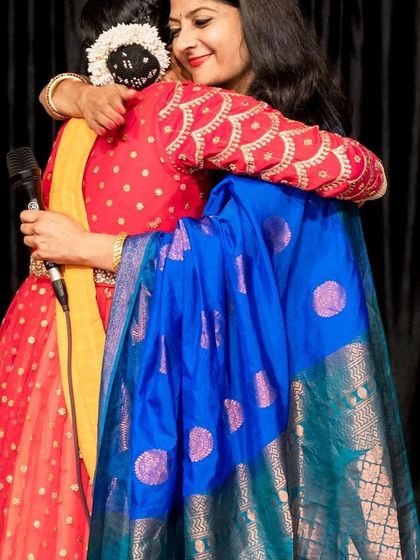 Sharing a heartfelt hug with my guru, Smt. Nirupama Rajendra, on the opening night of my dance school. Her guidance is my strength.