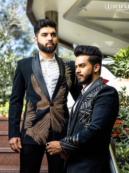 Two clients, two distinct styles. One wears a tuxedo with golden feather embroidery, the other with geometric beadwork. This showcases the personalized nature of my bespoke service.