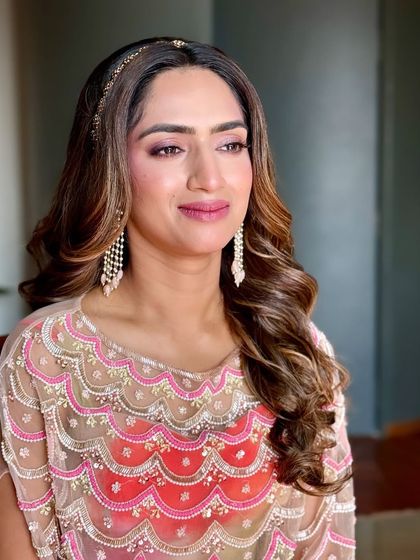 Dainty beauty and soft hues. This look is perfect for a bride or bridesmaid, featuring soft pink makeup and a simple, elegant headband.