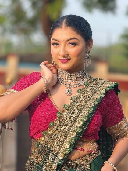 A close-up of the model's elegant look. The hairstyle is simple yet sophisticated, making it a versatile choice for any special occasion.