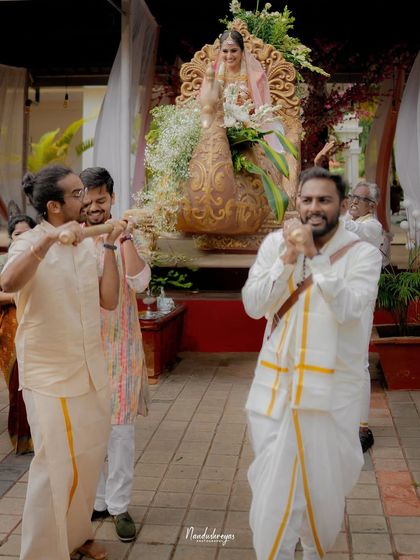 The bride's ceremonial entrance on a beautifully decorated palanquin. I capture the grandeur and tradition that make each wedding entrance a spectacular moment.