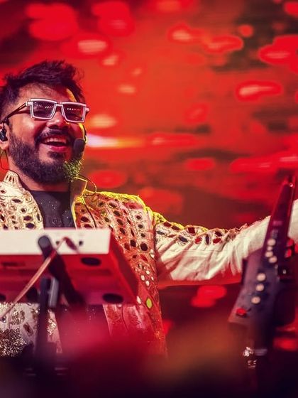 Our keyboardist, with his signature white glasses, enjoying the energy of the crowd at Parab Festival.