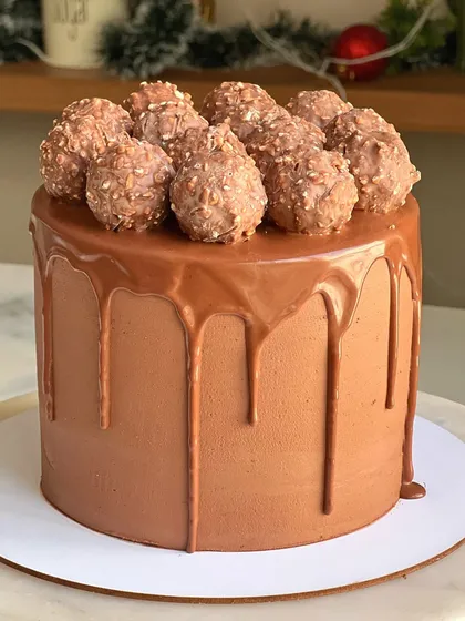 A classic and delicious choice for any kid's birthday. This chocolate drip cake is covered in rich chocolate ganache and topped with a pile of Ferrero Rocher chocolates.