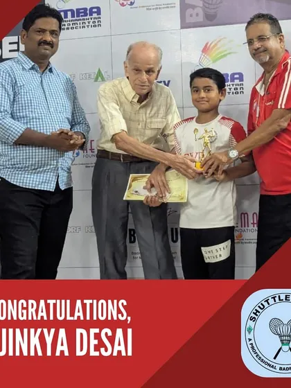 A moment of pride as Ajinkya Desai receives his winner's trophy for the Under-13 Boys Singles at the District Championship and Selection Tournament.